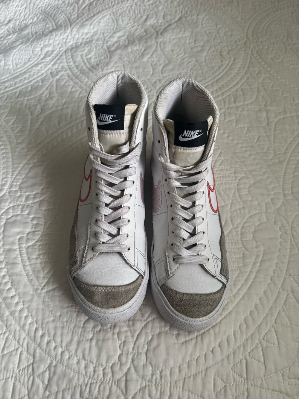 Nike White High-Top Sneakers with Red Swoosh